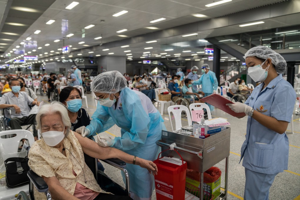 Thai health care workers administer AstraZenica vaccines in Bangkok. Photo: Bloomberg