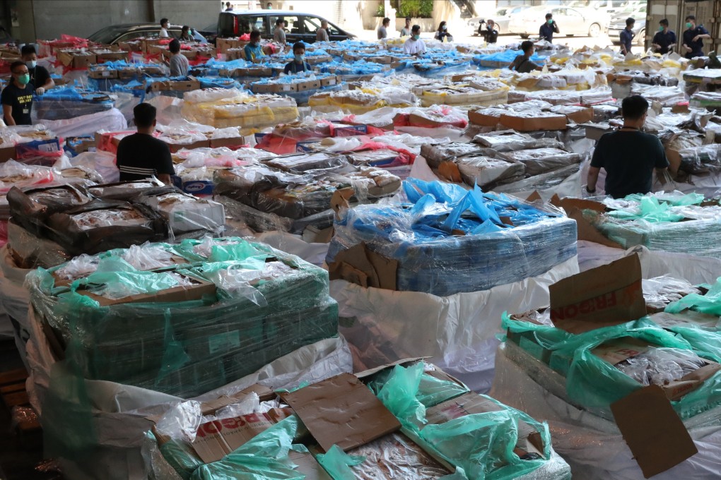 Thousands of tonnes of seized contraband meat are displayed by customs officials last year. Sources say triads are believed to be smuggling as much as 1,000 tonnes of meat a day to mainland China. Photo: Edmond So