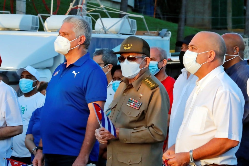 Cuba’s President Miguel Diaz-Canel, left, and Raul Castro, centre, in Havana, Cuba on Saturday. Photo: EPA-EFE