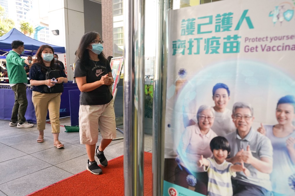 People queue to get their Covid-19 jabs at Sun Yat Sen Memorial Park Sports Centre. Photo: Felix Wong