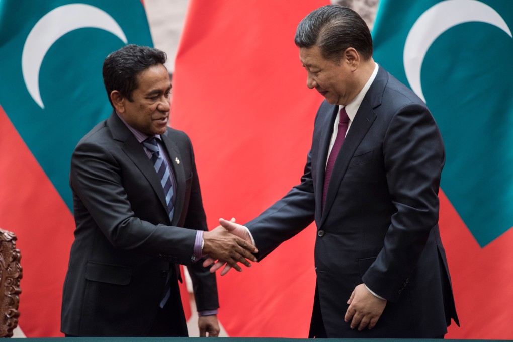 Abdulla Yameen, former president of the Maldives, shakes hand with China's President Xi Jinping after a meeting in Beijing in 2017. Photo: AFP