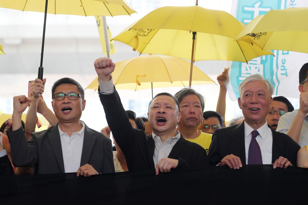 Sociologist Chan Kin-man (left) and fellow Occupy movement founders Benny Tai (centre) and Reverend Chu Yiu-ming (right) appear at West Kowloon Court in 2019. Photo: Sam Tsang