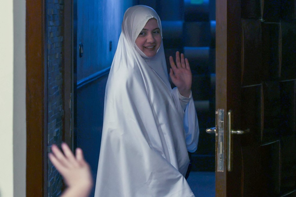 Muslim pilgrim Bushra Ali Shah, 35, bids her son farewell before departing for the haj, for the first time without a male guardian. Photo: AFP