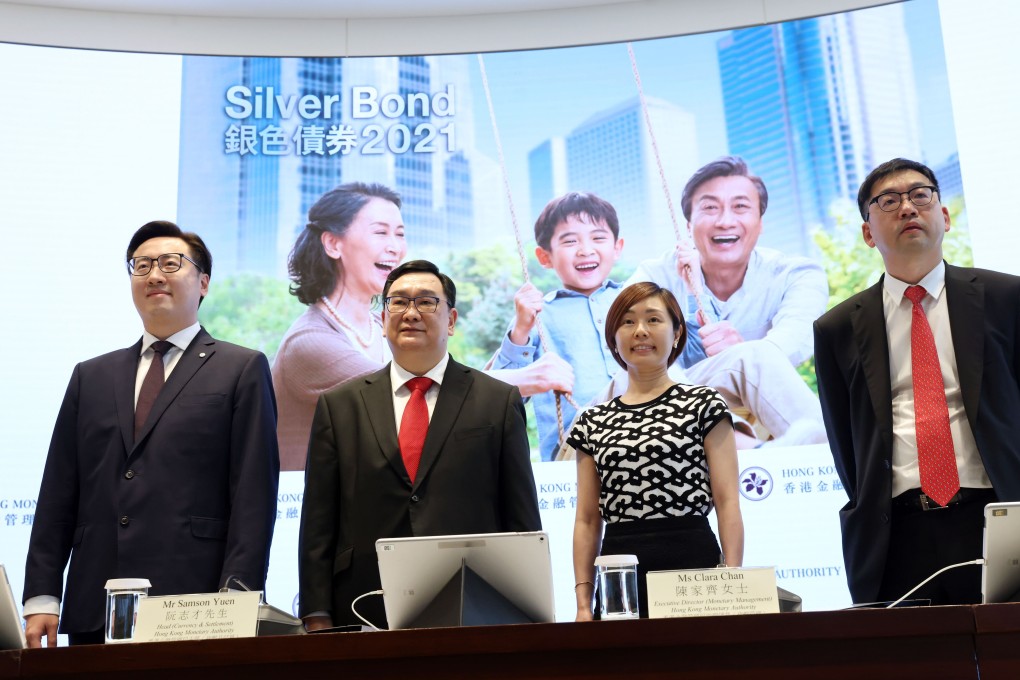 Banking officials at a Silver Bonds press conference on June 29, when it was announced that the age range was being lowered. Photo: K. Y. Cheng