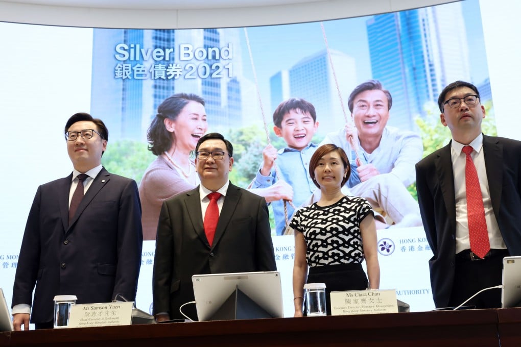 Banking officials at a Silver Bonds press conference on June 29, when it was announced that the age range was being lowered. Photo: K. Y. Cheng