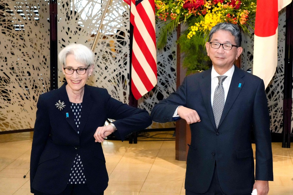 US Deputy Secretary of State Wendy Sherman, on a Asian tour, bumps elbows with Japan’s Vice-Minister for Foreign Affairs Takeo Mori before their meeting in Tokyo on Tuesday. Photo: AFP