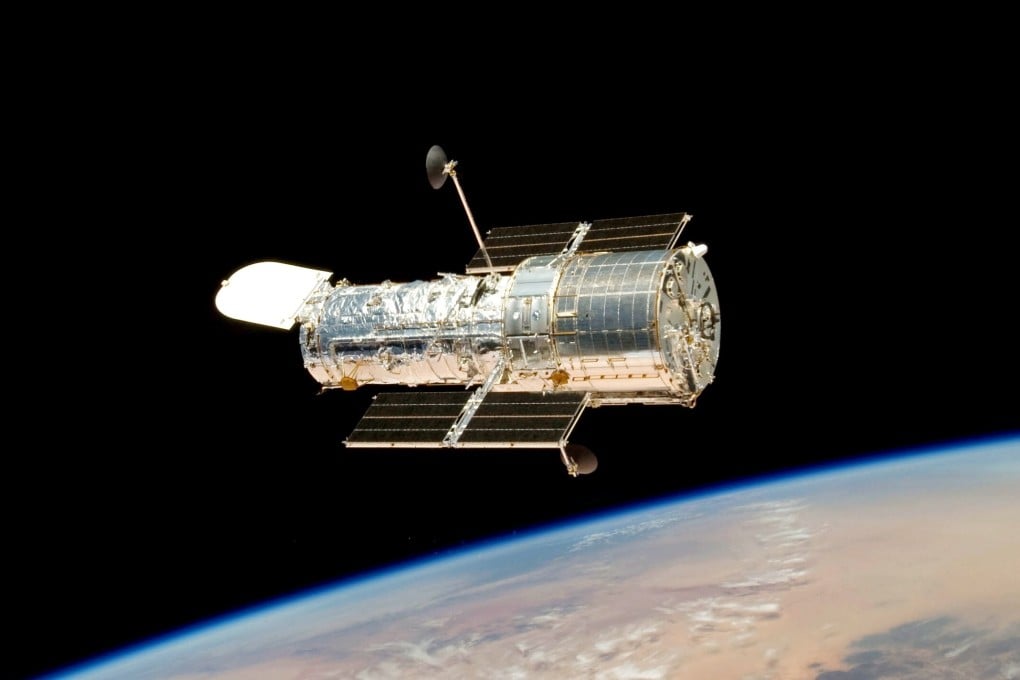 The Hubble Space Telescope drifting over Earth. File photo: EPA