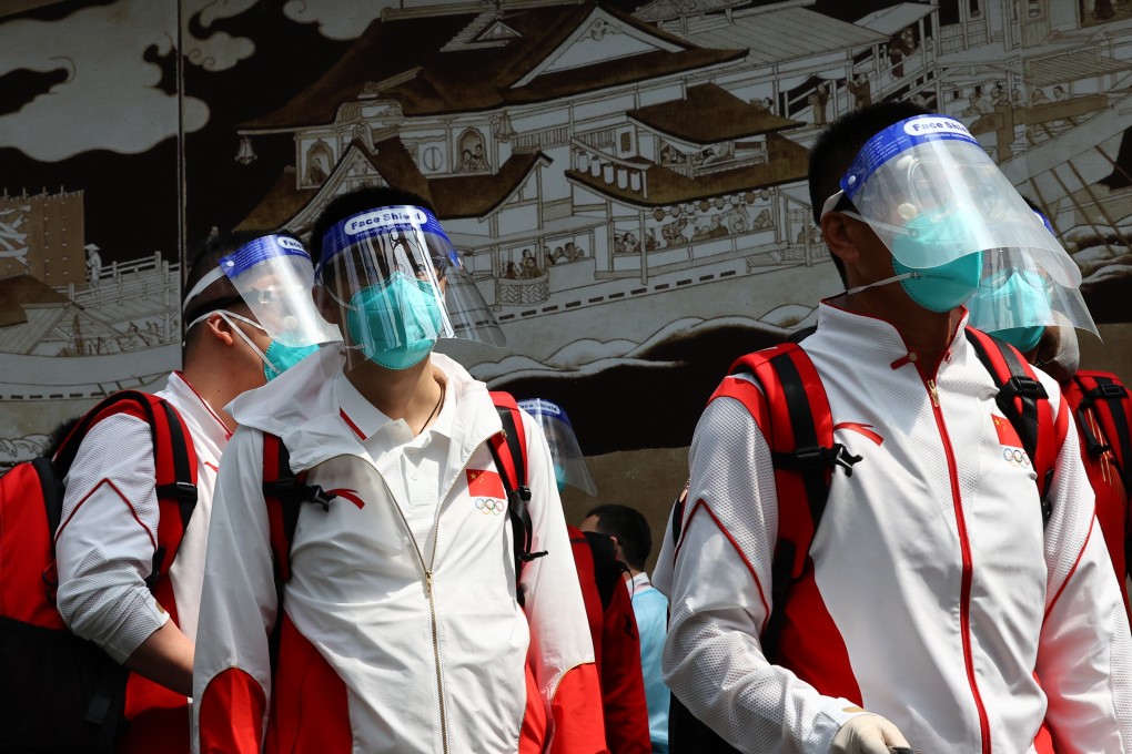 Members of the Chinese team wear protective masks and face shields as they arrive at Narita International Airport ahead of the Tokyo 2020 Olympic Games. Photo: Reuters