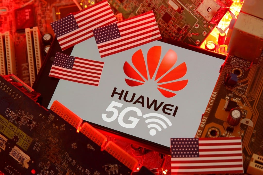 The US flag and a smartphone with the Huawei and 5G network logo are seen on a PC motherboard on January 29, 2020. Photo: Reuters