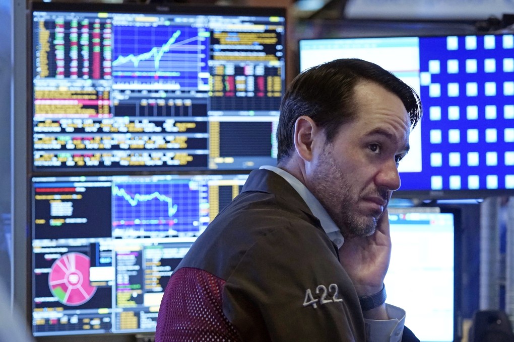 A trader works in a booth on the floor of the New York Stock Exchange, July 19, 2021. Photo: AP