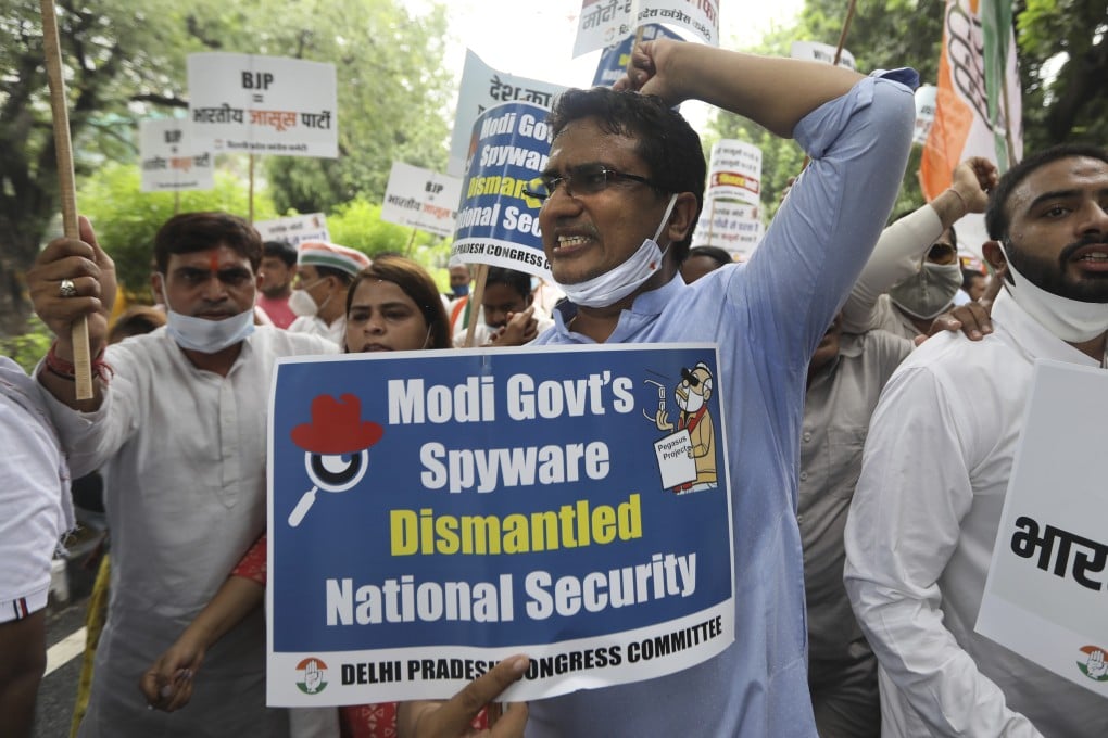 Protesters in New Delhi shout slogans as they accuse the Modi government of spying on opponents, journalists and activists. Photo: AP