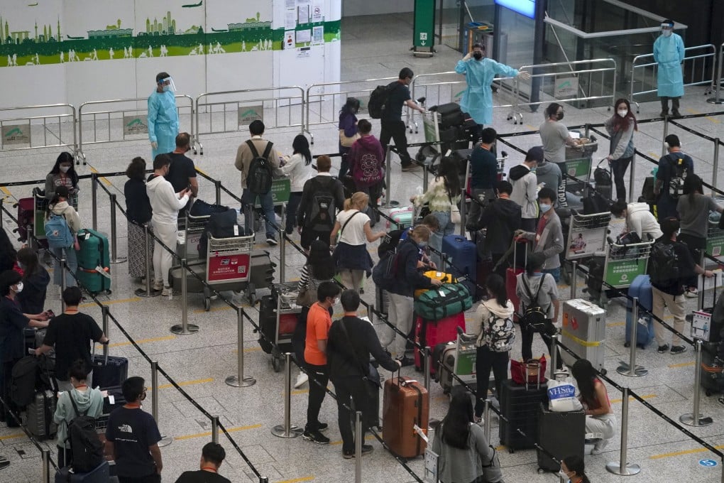 Passengers arriving at Hong Kong International Airport wait to be taken to a quarantine hotel. Photo: Felix Wong