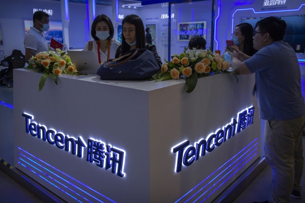 In this Sept. 5, 2020, photo, visitors gather at a display booth for Chinese technology firm Tencent at the China International Fair for Trade in Services (CIFTIS) in Beijing. Photo: AP