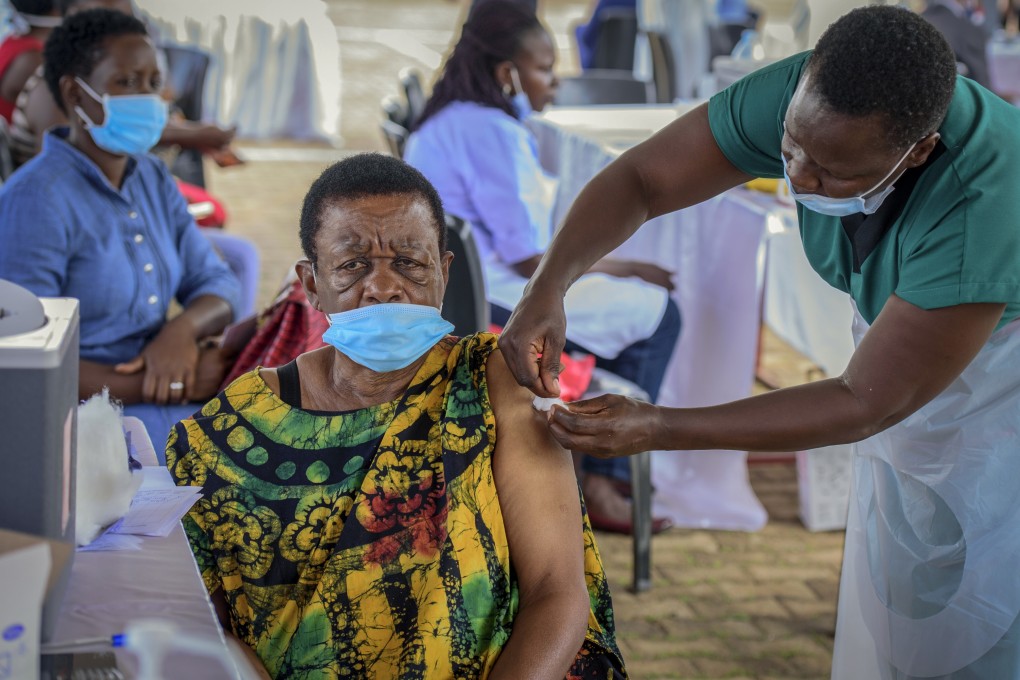 A woman receives a coronavirus vaccination at the Kololo airstrip in Kampala, Uganda. Photo: AP