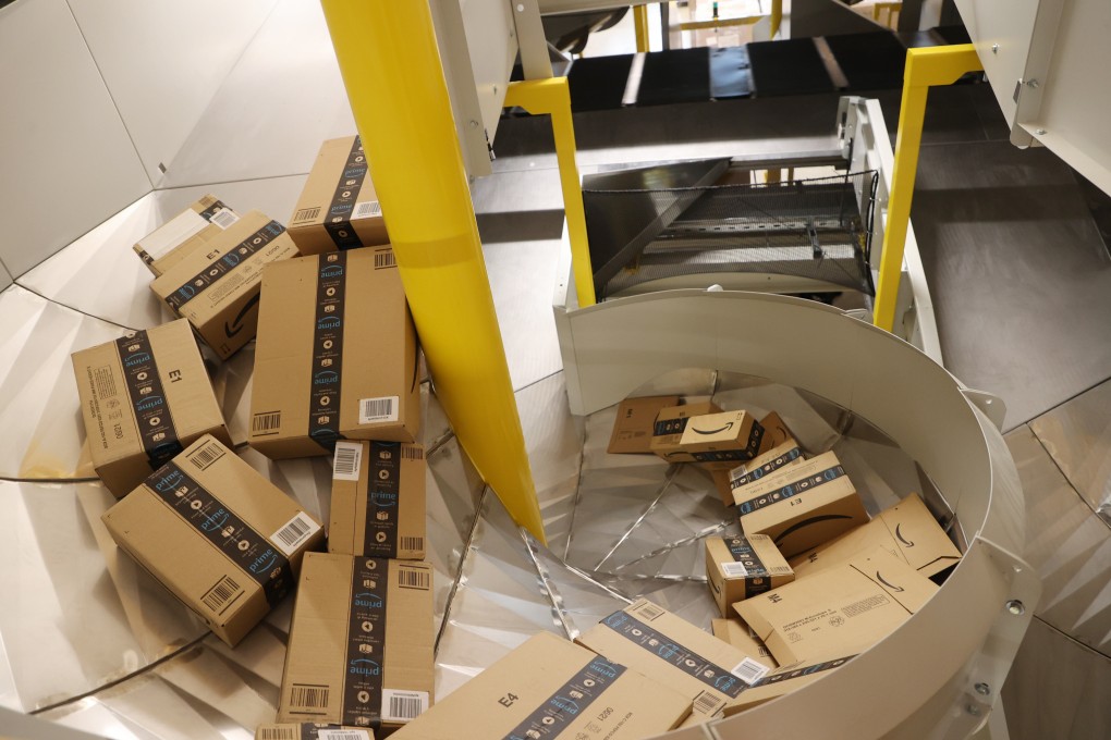 Amazon shipping boxes lie on conveyor belts during a trial run at the logistics hall of the new Amazon logistics centre in Gera, Germany, on July 21. Chinese cross-border e-commerce merchants are facing “growing pains”, a Beijing official said on Thursday, after Amazon banned some of the biggest sellers from its platform. Photo: dpa