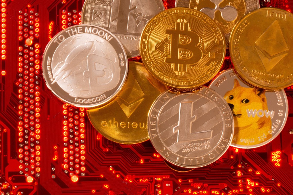 Representations of cryptocurrencies Bitcoin, Ethereum, DogeCoin, Ripple, Litecoin are seen on a PC motherboard. Photo: Reuters