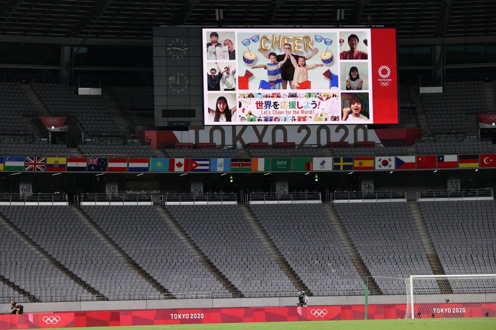 Virtual fans are seen on a giant screen during a Group G women’s football match during the Tokyo 2020 Olympic Games. Photo: Reuters