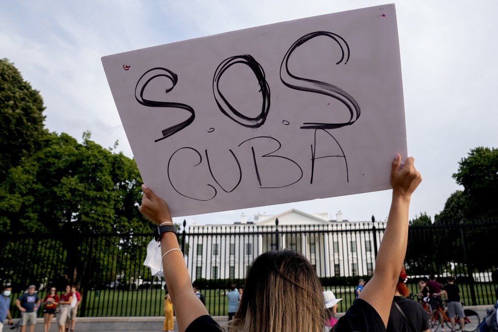 A demonstrator in solidarity with protests in Cuba outside the White House on July 18. Photo: Getty Images / TNS