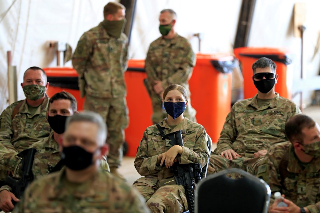 US soldiers wearing protective masks during a handover ceremony of Taji military base from US-led coalition troops to Iraqi security forces in Baghdad, Iraq in August 2020. Photo: Reuters