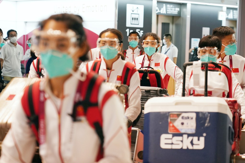Members of China’s Olympic delegation arrive at Narita airport in Tokyo on Sunday. Photo: Xinhua