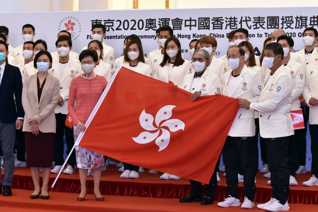 The Hong Kong squad with Chief Executive Carrie Lam Cheng Yuet-ngor at the Olympic flag presentation ceremony on July 8. Photo: Xinhua