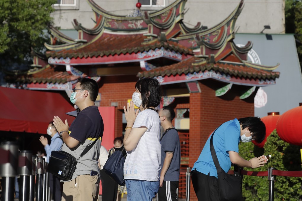 Some prayers have been answered in Taiwan with an easing in coronavirus restrictions from Tuesday. Photo: AP