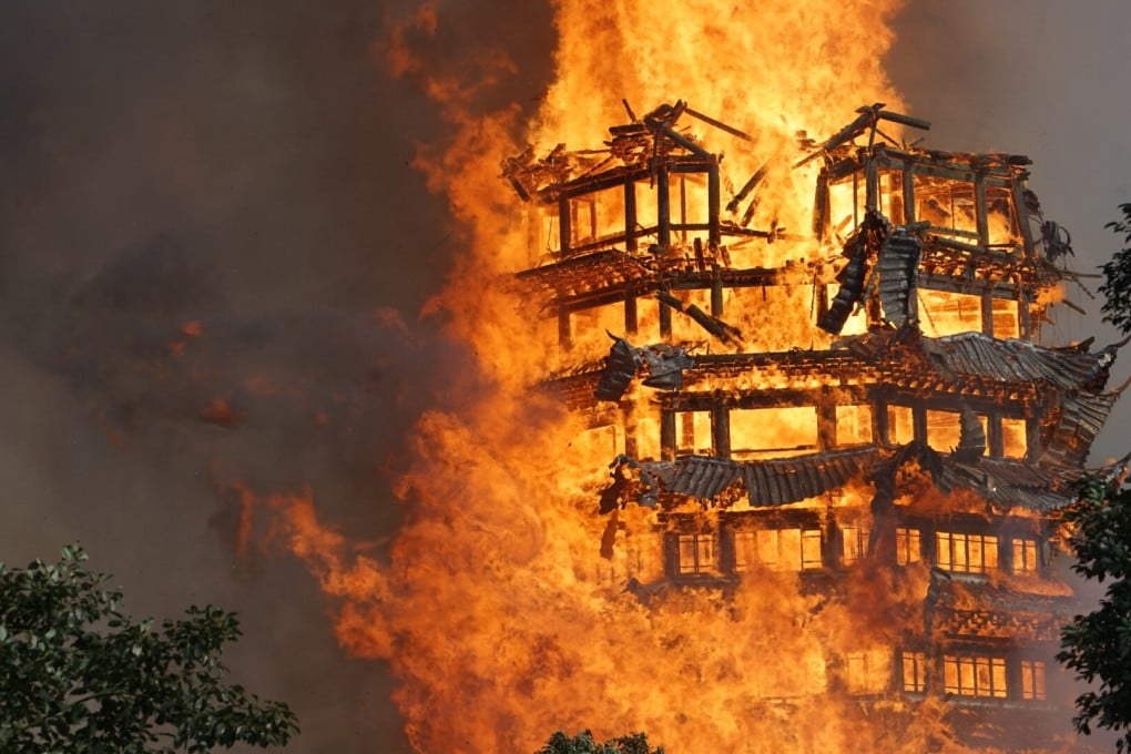 Asia’s tallest wood tower, the Jiulong temple, was destroyed by fire in Sichuan in 2017. Photo: Getty Images