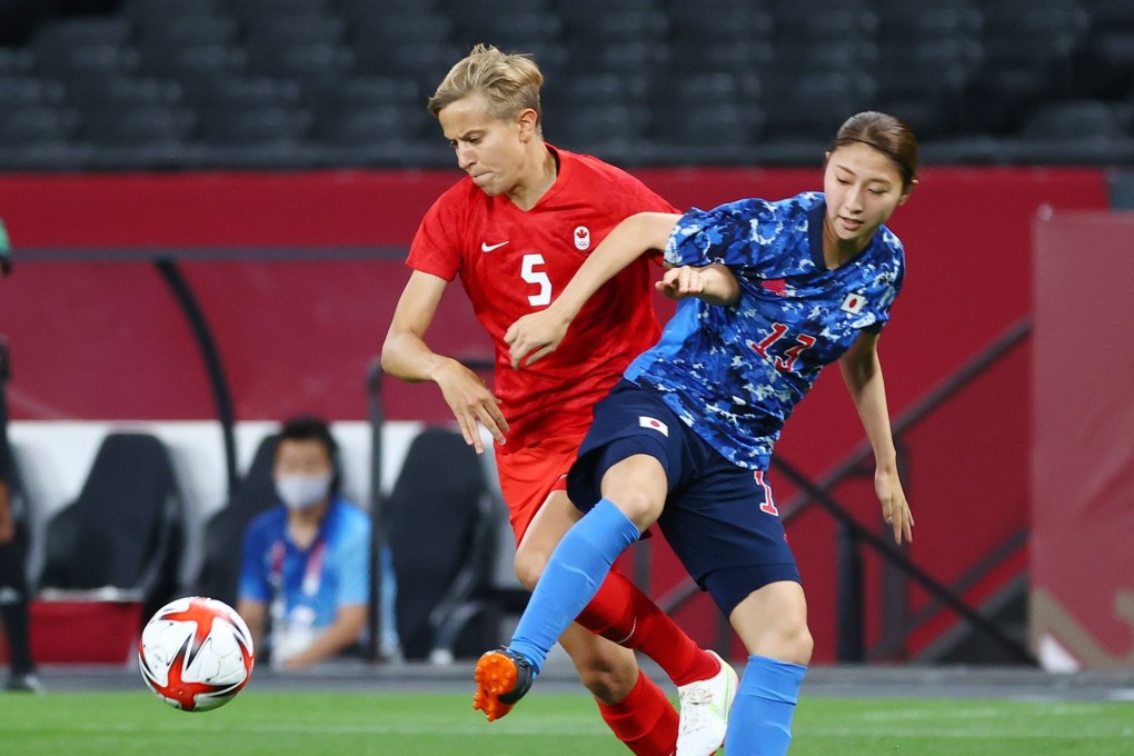 Canada’s Quinn, the first trans athlete to compete in the Olympics, vies for the ball with Japan’s Yuzuho Shiokoshi during their football game. Photo: Kim Hong-Ji