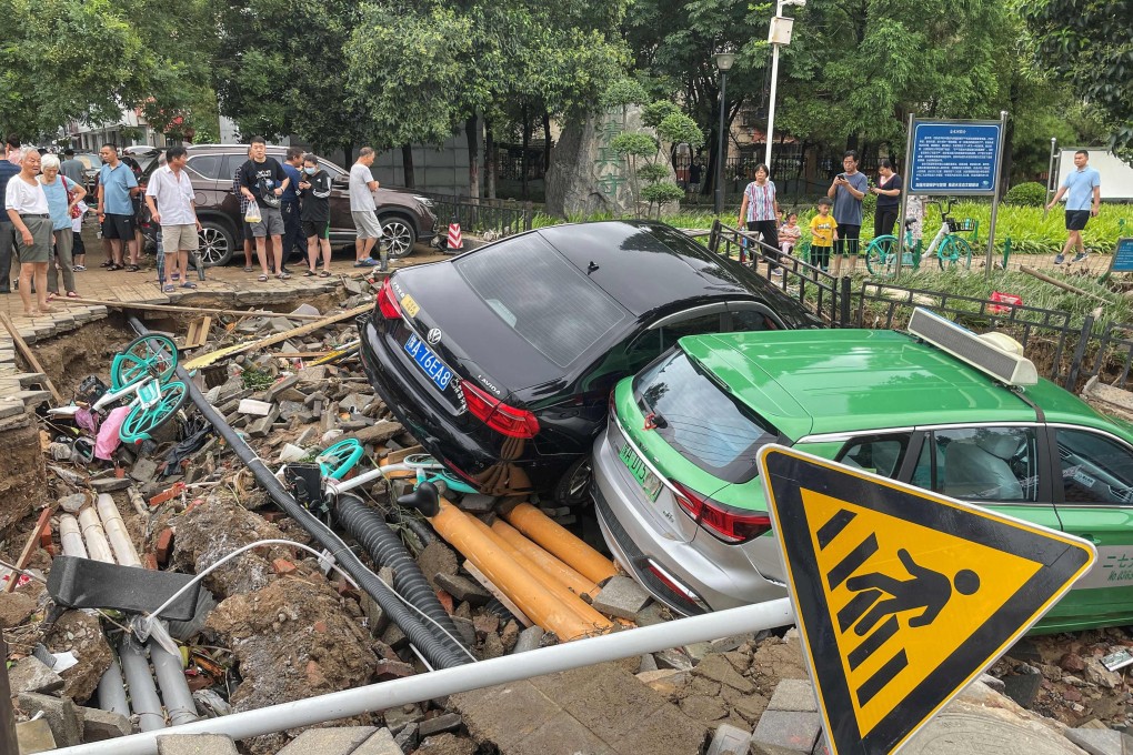 Damaged cars that were washed away by the floods in Zhengzhou. Photo: STR/ AFP