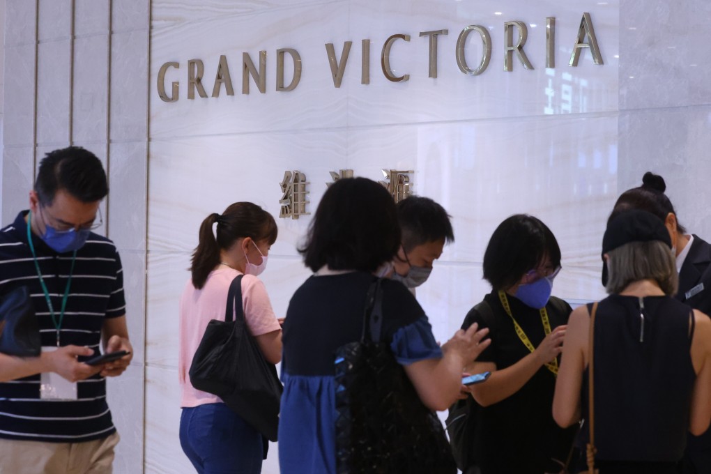 Buyers queuing to bid for 143 units of Grand Victoria flats at the developer’s sales office in Olympian City 2 on July 11, 2021. Photo: Dickson Lee