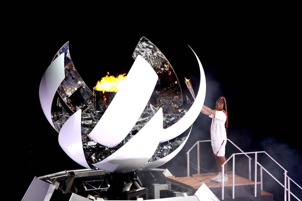 Naomi Osaka lighting the Olympic flame at the opening ceremony of the Tokyo 2020 Olympic Games. Photo: Getty Images