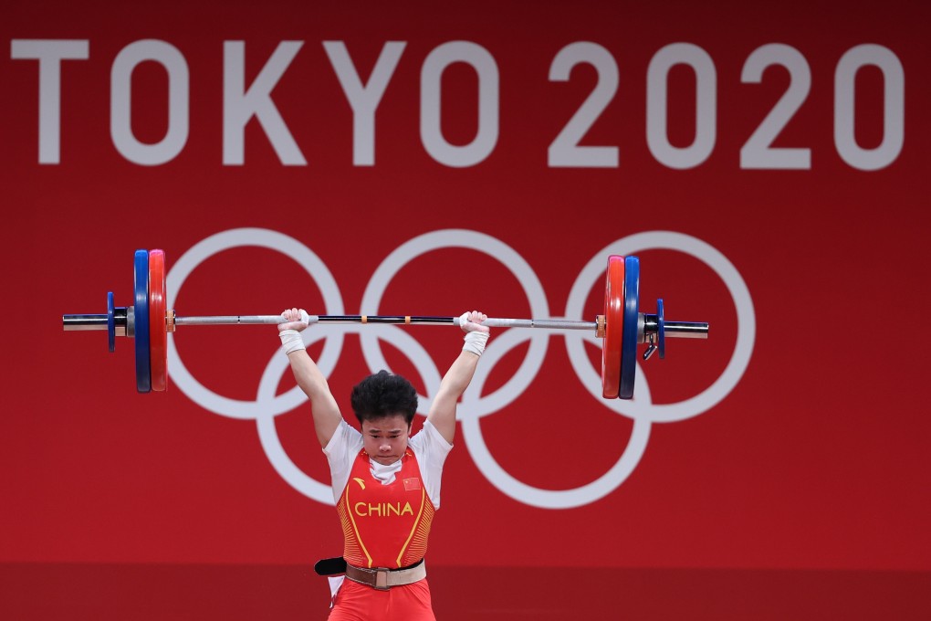 Hou Zhihui of China on her way to winning the women’s 49kg weightlifting event at the Olympic Games. Photo: Xinhua