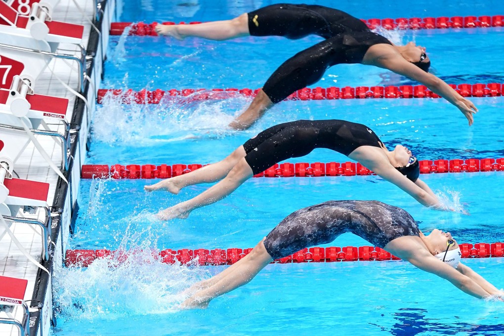 Hong Kong swimmer Stephanie Au Hoi-shun (third from top) at the start of the women's 100m backstroke heat at the Tokyo Aquatics Centre. Photo: Getty Images