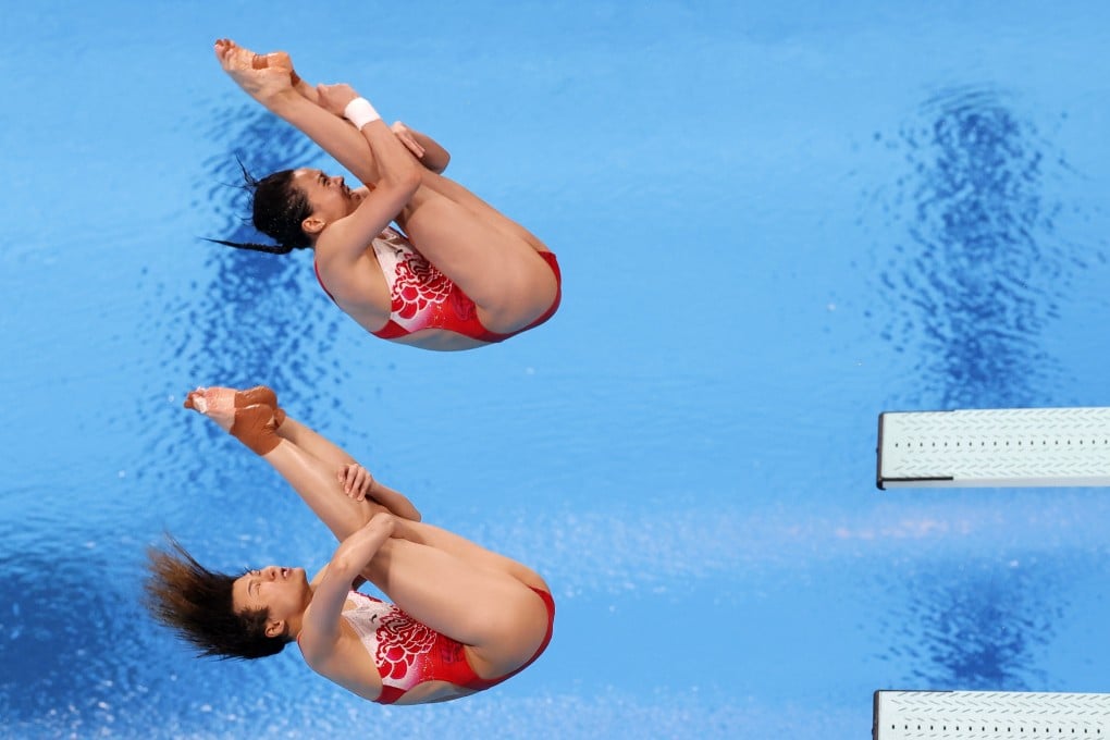 Shi Tingmao and Wang Han of China in action in the women’s diving synchronised 3m springboard final at the Tokyo 2020 Olympic Games. Photo: EPA