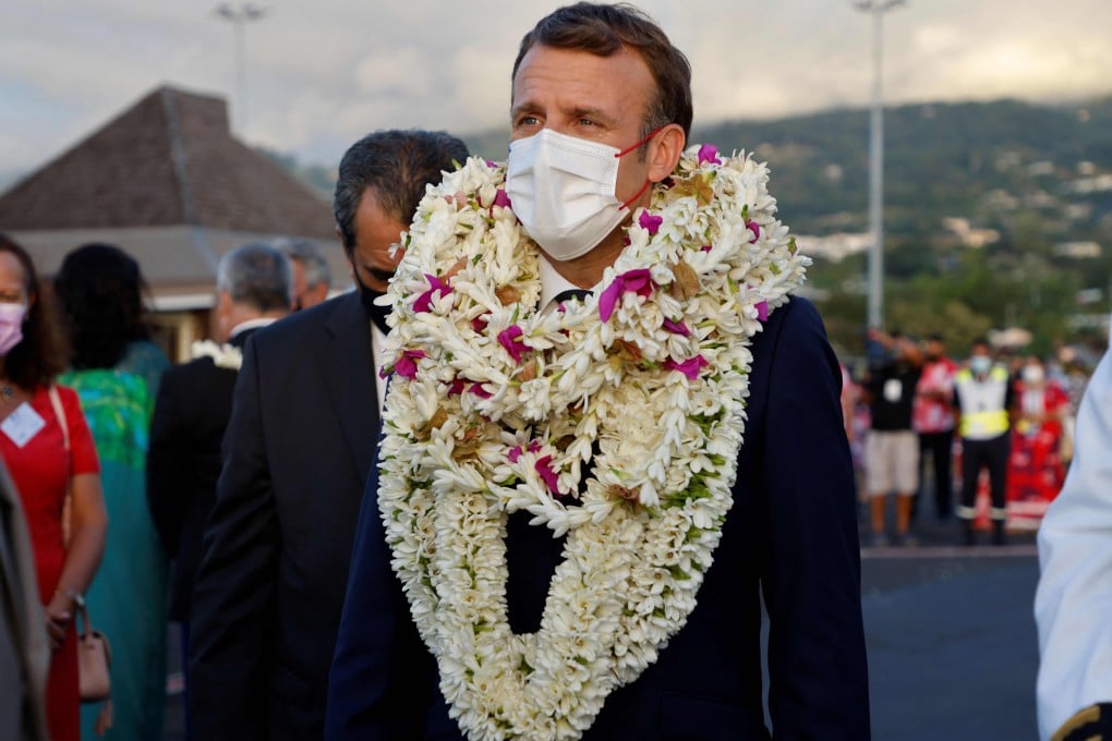 France's President Emmanuel Macron is welcomed on the tarmac upon his arrival at Faa'a international airport in Tahiti, French Polynesia. Photo: AFP