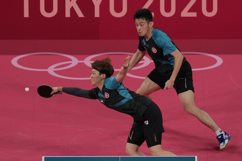 Hong Kong’s Doo Hoi-kem reaches for a return, tracked by partner Wong Chun-ting, in their mixed doubles loss at the quarter-final stage. Photo: AP