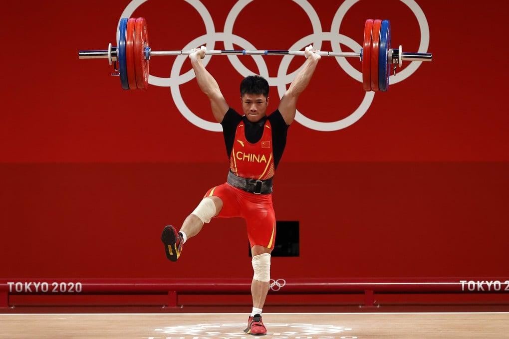 China’s Li Fabin, known as the ‘Flamingo’, wins the men’s 61kg weightlifting gold at the Tokyo 2020 Olympic Games on Sunday. Photo: EPA-EFE