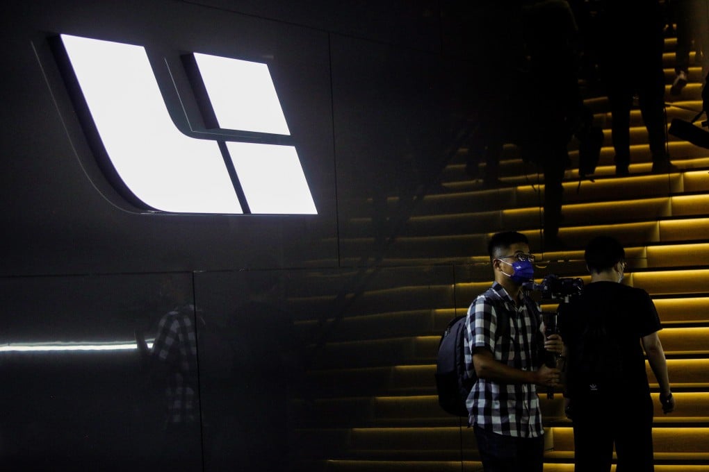 The logo of Chinese electric-vehicle maker Li Auto is displayed at an event in Beijing. The start-up is looking to ramp up output with funds from its upcoming Hong Kong IPO. Photo: Reuters