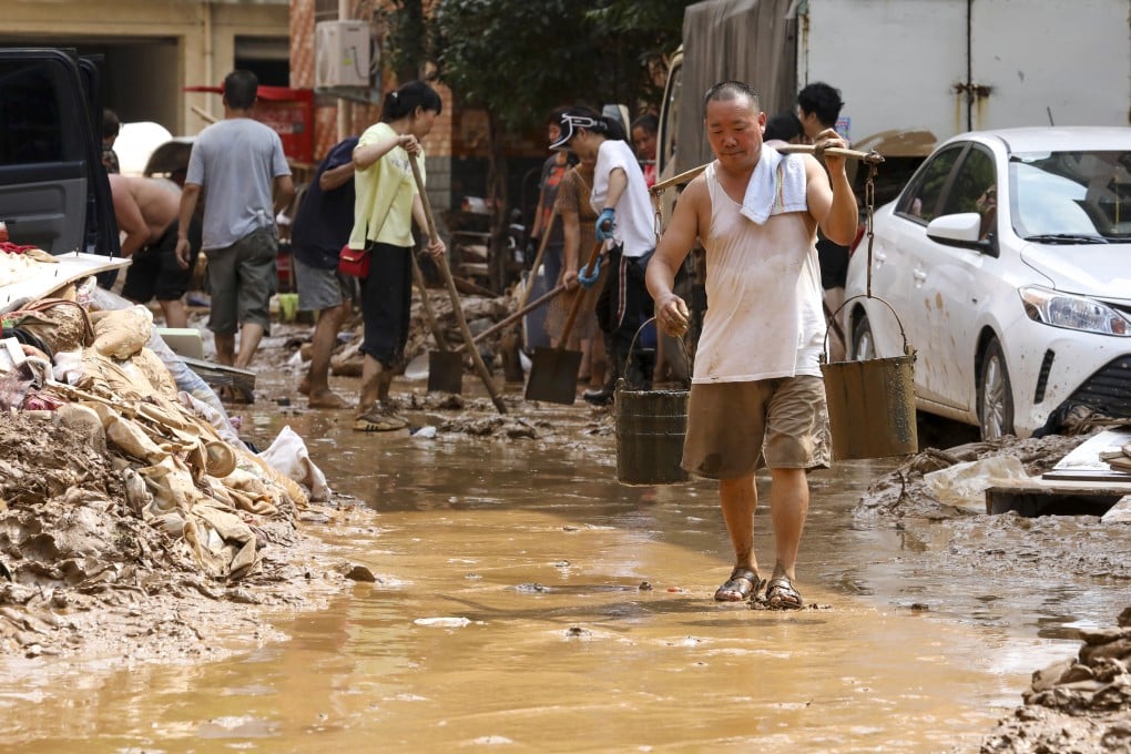 Residents in the village of Mibei in Gongyi continue on the long road to cleaning up after the floods. Photo: Simon Song