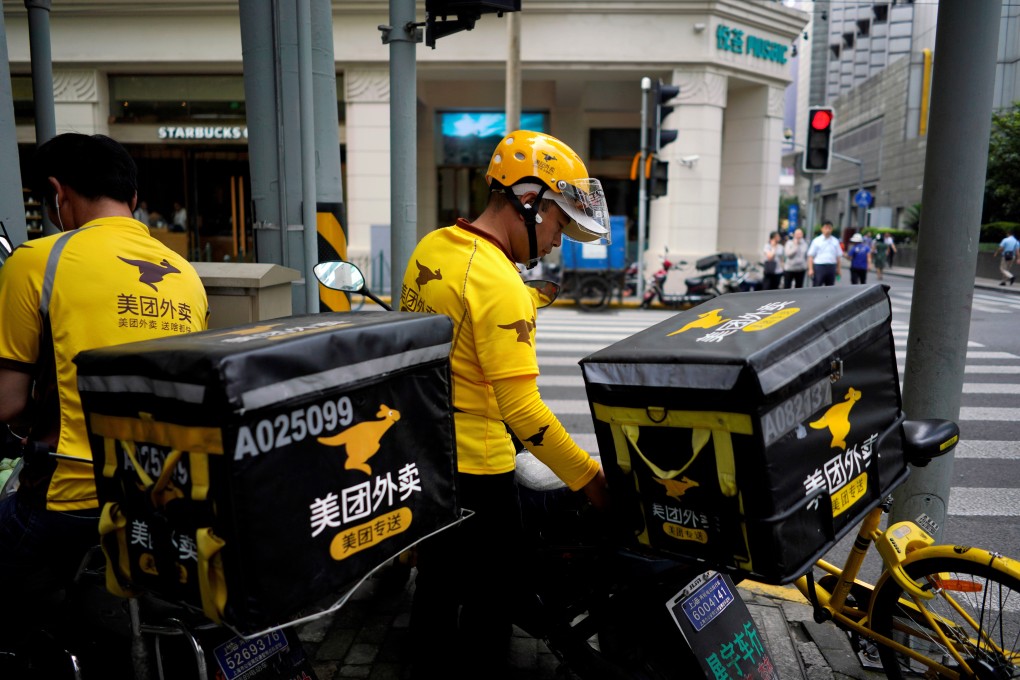 Drivers of food delivery service Meituan are seen in Shanghai, China. Photo: Reuters