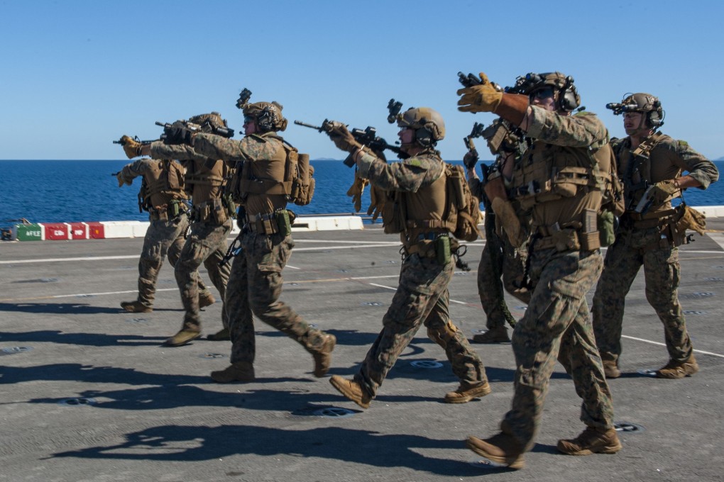 Marines rehearse an armed assault aboard the USS New Orleans. Photo: Handout