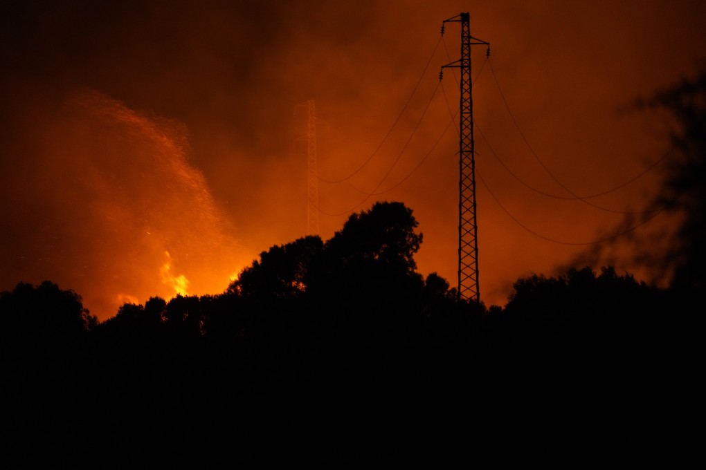 Fires rage through the countryside in Cuglieri near Oristano, Sardinia, Italy on Sunday. Photo: LaPresse via AP