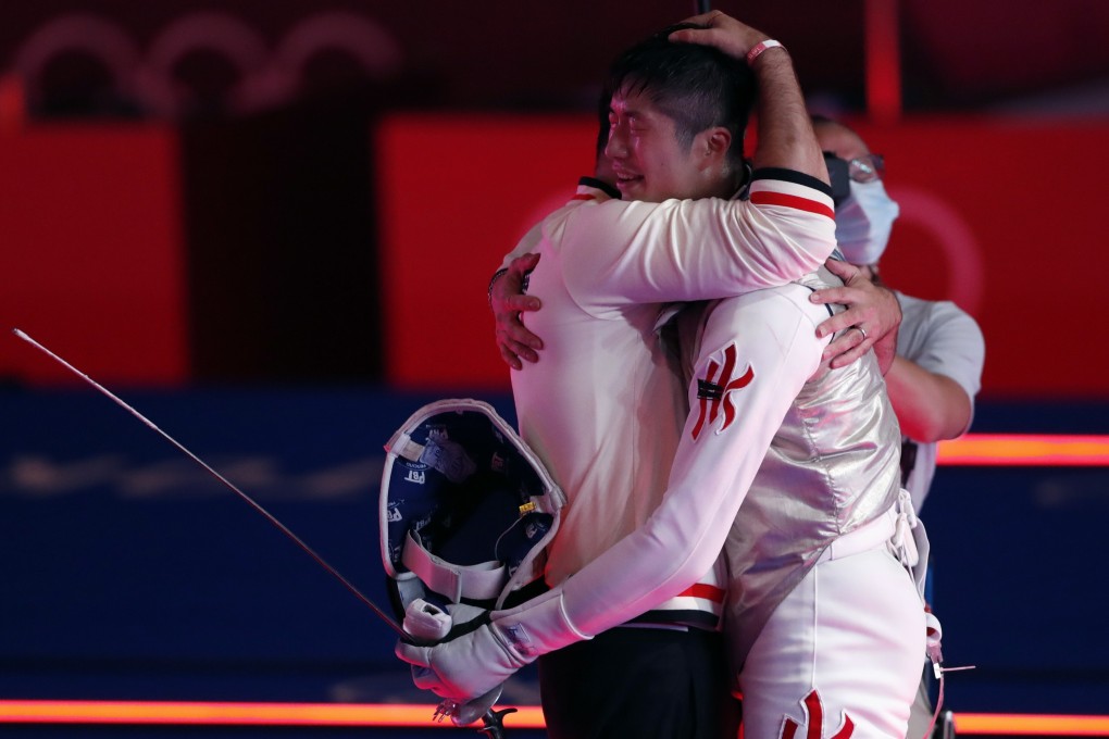 Hong Kong’s Cheung Ka-long embraces coach Greg Koenig after winning gold in the men’s foil in Tokyo. Photo: EPA