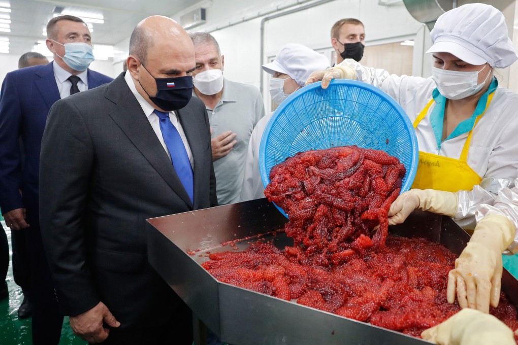 Russian Prime Minister Mikhail Mishustin visits a fish processing factory in Russia’s Kuril Islands on July 26, 2021. Photo: EPA-EFE
