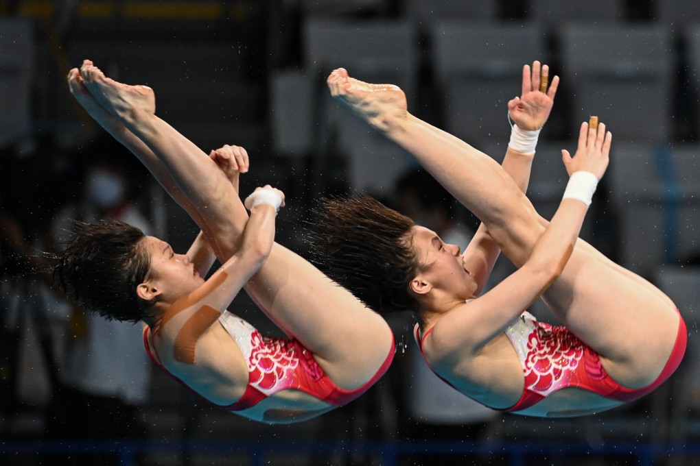 Chen Yuxi and Zhang Jiaqi of China compete during the women’s synchronised 10m platform final at Tokyo 2020 Olympics. Photo: Xinhua