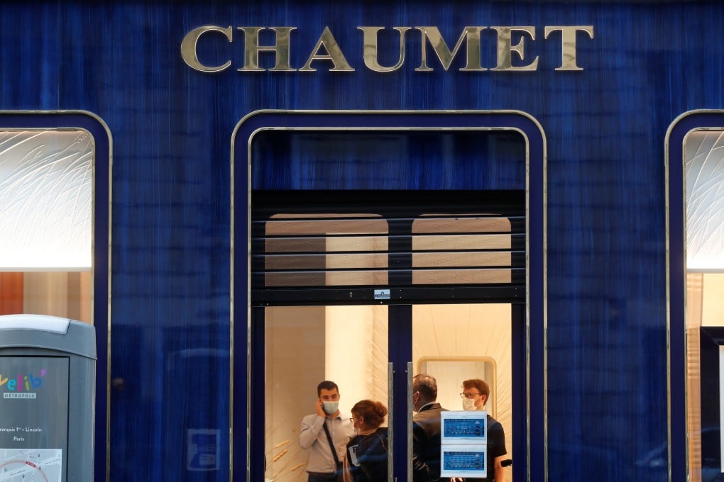 Police inside the Chaumet jewellery store after the robbery. Photo: Reuters