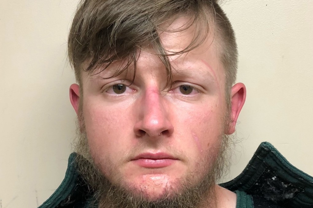 Robert Aaron Long after being booked by police. Photo: TNS