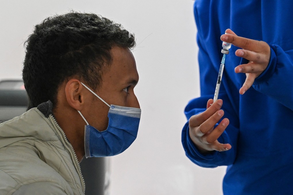 The Chinese CoronaVac vaccine is prepared in an immunisation clinic in Bogota. A Chinese research team is looking at how long CoronaVac induces immunity and how best to use a booster shot. Photo: AFP
