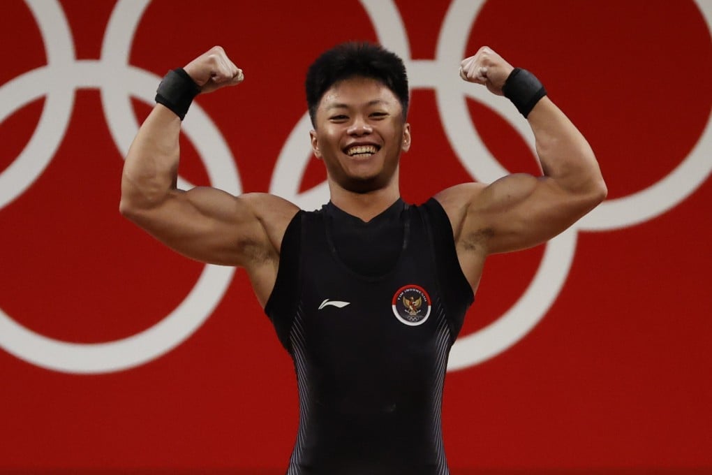 Rahmat Erwin Abdullah of Indonesia reacts after an attempt in the men's 73kg group B weightlifting event at the Tokyo 2020 Olympics. Photo: EPA