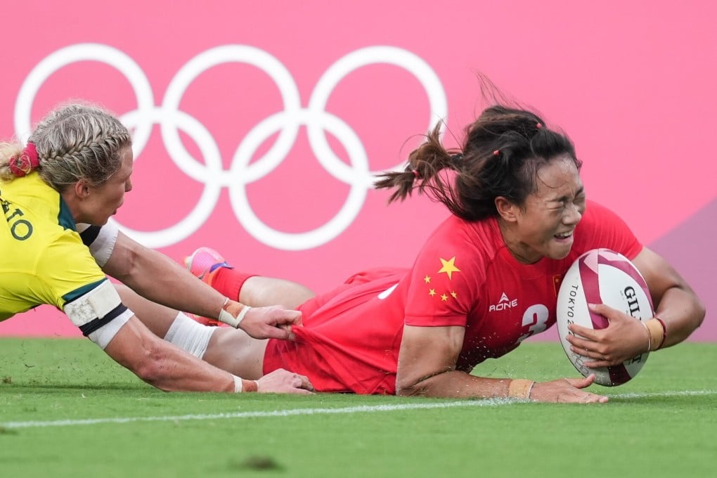 China rugby sevens player Tang Minglin scores against Australia in their women's pool C match at the Tokyo Stadium. Photo: Xinhua